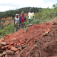 This family lost a relative to Cyclone Idai. Here they stand next to the grave in Chimanimani, Zimbabwe.